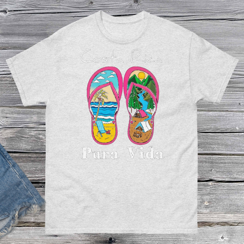 ProdProduct m"Unisex classic fit t-shirt featuring a vibrant collage-style design that celebrates Costa Rica, including tropical elements like toucans, sloths, beaches, waves, and jungle foliage. The colorful graphic is set against a neutral shirt color, capturing the laid-back and adventurous spirit of Pura Vida."uct mockup