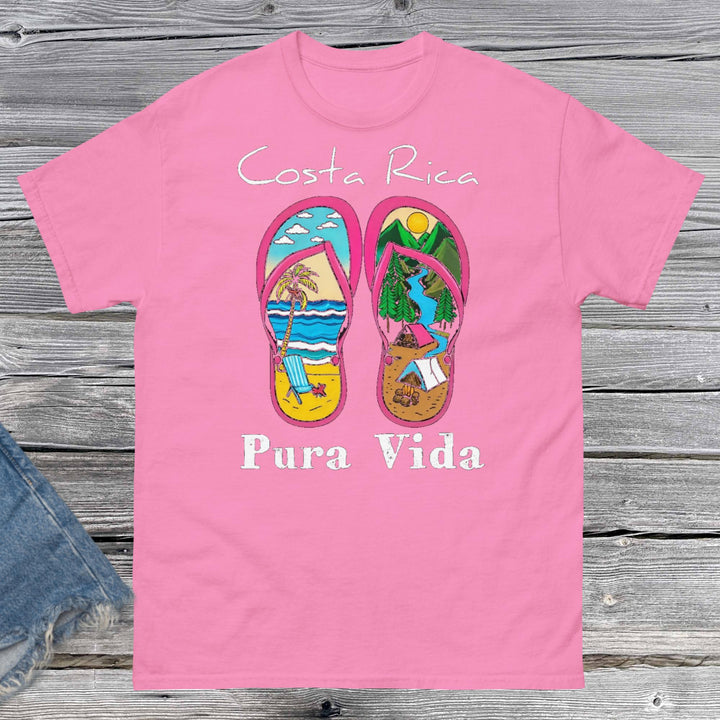 Product mProduct m"Unisex classic fit t-shirt featuring a vibrant collage-style design that celebrates Costa Rica, including tropical elements like toucans, sloths, beaches, waves, and jungle foliage. The colorful graphic is set against a neutral shirt color, capturing the laid-back and adventurous spirit of Pura Vida."ockup